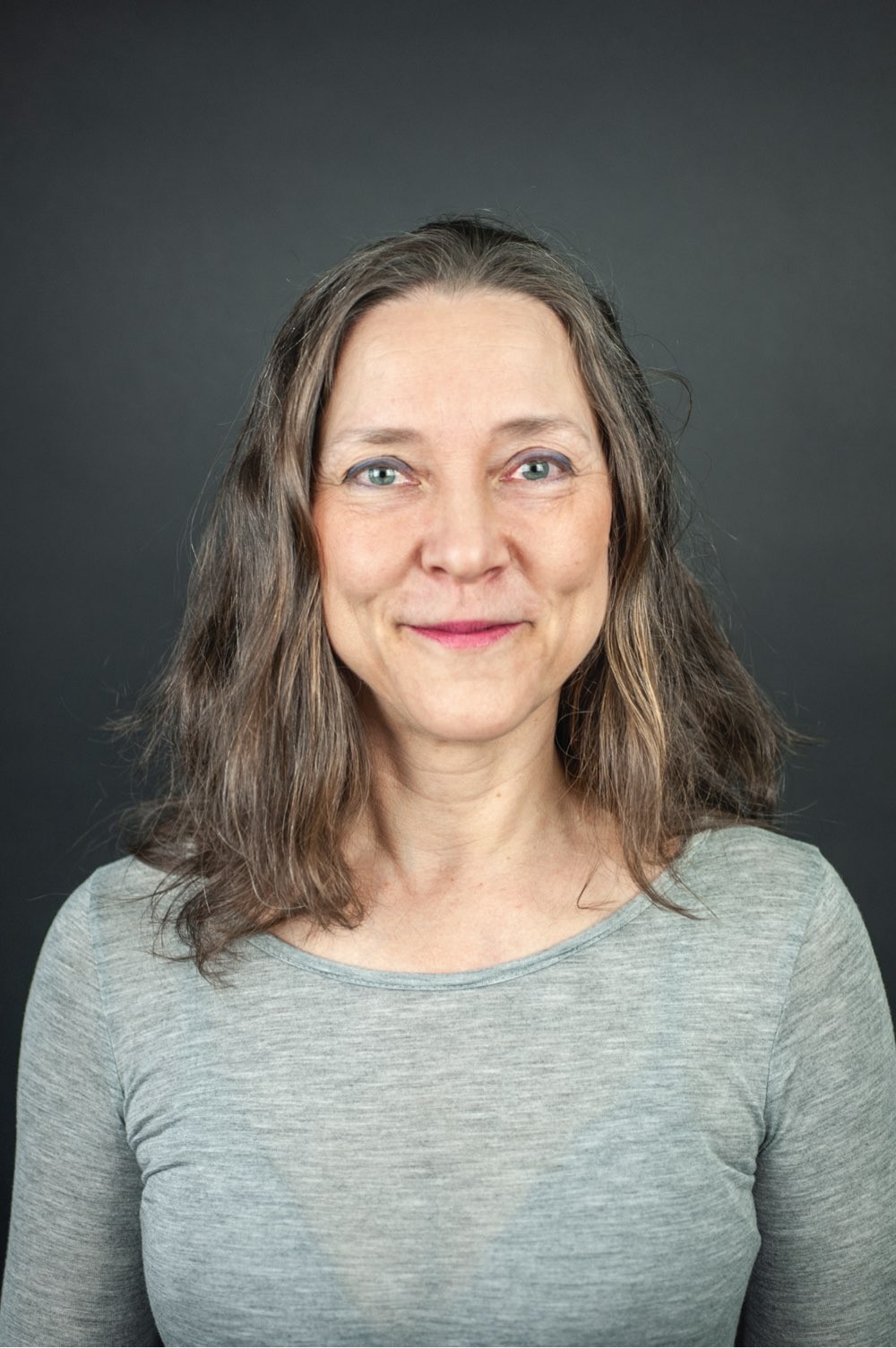 Portrait of Tiina Suhonen - grey background