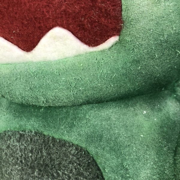 Nærbilde av en gronn dukke